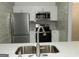 Modern kitchen featuring stainless steel appliances, a sink, and white cabinets at 3083 Colonial Way # N, Atlanta, GA 30341