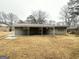 A spacious backyard and covered patio offer endless possibilities at 3403 Dodson Ter, East Point, GA 30344
