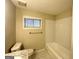 Bathroom featuring subway tile backsplash, a marble countertop, a window with blinds, and a bathtub shower at 3403 Dodson Ter, East Point, GA 30344