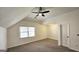 Bright bedroom featuring neutral paint, carpet, and ceiling fan at 7249 Misty Harbor Ct, Stone Mountain, GA 30087