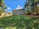 Expansive backyard featuring a large, well-maintained lawn and mature trees at 5725 Cedar Pass, Fairburn, GA 30213