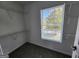 Walk-in closet with shelves, carpet, and a window for light at 5725 Cedar Pass, Fairburn, GA 30213