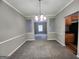 Dining room with carpeting, neutral paint, and trim at 5725 Cedar Pass, Fairburn, GA 30213