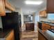 Updated kitchen featuring wood cabinets, granite countertops, and stainless steel appliances at 5725 Cedar Pass, Fairburn, GA 30213
