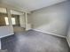 Spacious living room with neutral gray carpet and fresh paint at 5725 Cedar Pass, Fairburn, GA 30213