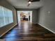 Inviting living room features sleek wood floors and an open concept layout to the kitchen at 5725 Cedar Pass, Fairburn, GA 30213