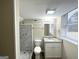 Bathroom with a tiled shower, granite countertop, and modern vanity at 3820 Union Sw Rd, College Park, GA 30349