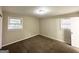 Comfortable bedroom features plush carpeting, neutral paint, and inviting natural light at 3820 Union Sw Rd, College Park, GA 30349