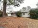 Ranch-style home featuring a brick facade, covered entry, and well-maintained landscaping at 3820 Union Sw Rd, College Park, GA 30349