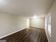 Spacious living room with hardwood floors, neutral walls, and natural light from windows at 3820 Union Sw Rd, College Park, GA 30349