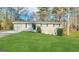 Charming single-story home with well-manicured front lawn and inviting entrance at 4954 Springbrook Dr, Douglasville, GA 30135