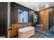 Bathroom featuring a freestanding soaking tub, walk-in shower and modern fixtures at 740 Bethpage Dr, Mcdonough, GA 30253