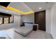 Modern bedroom with hardwood floors and a unique ceiling with ambient lighting at 740 Bethpage Dr, Mcdonough, GA 30253