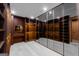 Spacious walk-in closet with mirrored doors, custom shelving, and bright, built-in lighting at 740 Bethpage Dr, Mcdonough, GA 30253
