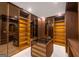 Walk-in closet with custom shelving and bright lighting at 740 Bethpage Dr, Mcdonough, GA 30253