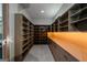 Spacious walk-in closet with custom shelving and cabinet, offering ample storage at 740 Bethpage Dr, Mcdonough, GA 30253