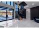 Grand foyer with stunning staircase and a large window providing ample natural light at 740 Bethpage Dr, Mcdonough, GA 30253