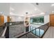 Open hallway with a modern chandelier and a view of the living area below at 740 Bethpage Dr, Mcdonough, GA 30253