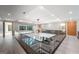 Second floor hallway overlooking the living area below with glass railings and modern light fixture at 740 Bethpage Dr, Mcdonough, GA 30253