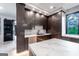 Sleek kitchen with modern cabinets, marble countertops, stainless steel appliances and black fixtures at 740 Bethpage Dr, Mcdonough, GA 30253