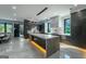 Modern kitchen with glossy cabinets, marble countertops, undermount island lighting, and integrated appliances at 740 Bethpage Dr, Mcdonough, GA 30253