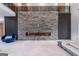Living room features a fireplace, accent wall and large windows providing plenty of natural light at 740 Bethpage Dr, Mcdonough, GA 30253