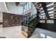 Modern staircase with wood treads, glass railing and lots of natural light at 740 Bethpage Dr, Mcdonough, GA 30253