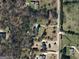 Aerial view of a neighborhood with mature trees, boundary lines, and street view at 3411 Airline Rd, Mcdonough, GA 30252