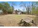 Exterior view of a home with a screened-in porch and expansive backyard at 3411 Airline Rd, Mcdonough, GA 30252