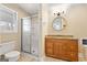 Bathroom with a shower, vanity, granite countertop, and round mirror at 3411 Airline Rd, Mcdonough, GA 30252