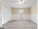 Bedroom with a closet, a window, light colored walls, and vinyl plank flooring at 3411 Airline Rd, Mcdonough, GA 30252