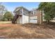 Back exterior view of house with screened porch and garage at 3411 Airline Rd, Mcdonough, GA 30252