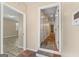 Inviting hallway with tiled flooring and neutral paint, connecting different areas of the home at 3411 Airline Rd, Mcdonough, GA 30252