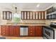 A lovely kitchen with wood cabinets, a stainless steel dishwasher, and tile backsplash at 3411 Airline Rd, Mcdonough, GA 30252