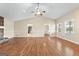 Bright and airy living room with hardwood floors, a ceiling fan, and views to adjacent rooms at 3411 Airline Rd, Mcdonough, GA 30252