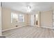 Spacious main bedroom featuring a ceiling fan, light colored walls and vinyl plank flooring at 3411 Airline Rd, Mcdonough, GA 30252