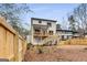 Spacious backyard featuring a wooden fence, large deck and stairs leading to upper level at 1055 Ormewood Se Ave, Atlanta, GA 30316