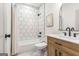 Bathroom featuring honeycomb tile in the shower and a light wood vanity at 1055 Ormewood Se Ave, Atlanta, GA 30316