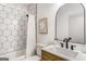 Stylish bathroom features modern fixtures, hexagon tile shower, and neutral color palette at 1055 Ormewood Se Ave, Atlanta, GA 30316