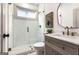 Modern bathroom with glass shower, tile flooring, and neutral vanity at 1055 Ormewood Se Ave, Atlanta, GA 30316