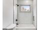 Beautiful bathroom showcasing a subway tile shower, providing a serene bathing experience at 1055 Ormewood Se Ave, Atlanta, GA 30316