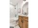 Bathroom with hexagon tile in shower and wood vanity at 1055 Ormewood Se Ave, Atlanta, GA 30316