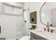 Well lit bathroom featuring a glass shower, decorative mirror, and stylish vanity at 1055 Ormewood Se Ave, Atlanta, GA 30316