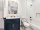 Elegant bathroom featuring modern vanity, marble countertop, subway tile shower, and bronze fixtures at 1055 Ormewood Se Ave, Atlanta, GA 30316