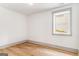 Bedroom with hardwood floors, light walls and trim and window at 1055 Ormewood Se Ave, Atlanta, GA 30316