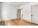 Bright bedroom features hardwood floors, white walls and neutral trim and doors at 1055 Ormewood Se Ave, Atlanta, GA 30316