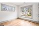 Inviting bedroom with hardwood floors and large windows, providing ample natural light and neighborhood views at 1055 Ormewood Se Ave, Atlanta, GA 30316