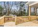 New wooden deck overlooking a large backyard with mature trees at 1055 Ormewood Se Ave, Atlanta, GA 30316