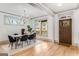 Modern dining room with elegant chandelier and a view of the neighborhood at 1055 Ormewood Se Ave, Atlanta, GA 30316