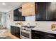 Close up of kitchen stove, cabinets, countertops, and backsplash at 1055 Ormewood Se Ave, Atlanta, GA 30316